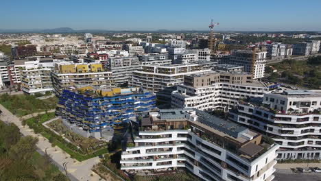 Aerial-shot-towards-modern-eco-district-Port-Marianne-Montpellier-river-Lez.